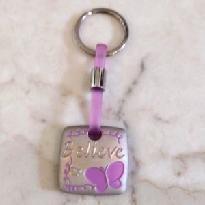 Cag beautiful believe metal keychain.